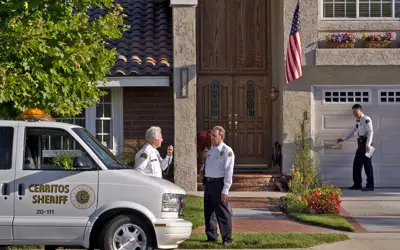 Volunteers on Patrol checking on a home