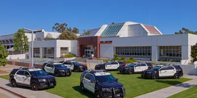 High angle of Sheriff's Station with police vehicles