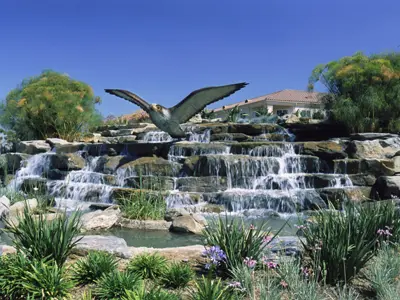 Falcon sculpture and waterfall fountain