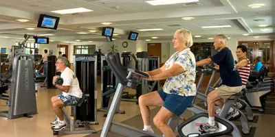 Seniors exercising in fitness center